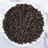 Premium Luxurious Ceylon Pekoe Tea loose-leaf black tea from Sri Lanka with bright golden amber infusion by Johns Ceylon Tea UK