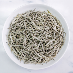 Premium Ceylon Silver Tips white tea handcrafted from unopened tea buds with pale golden infusion by Johns Ceylon Tea UK