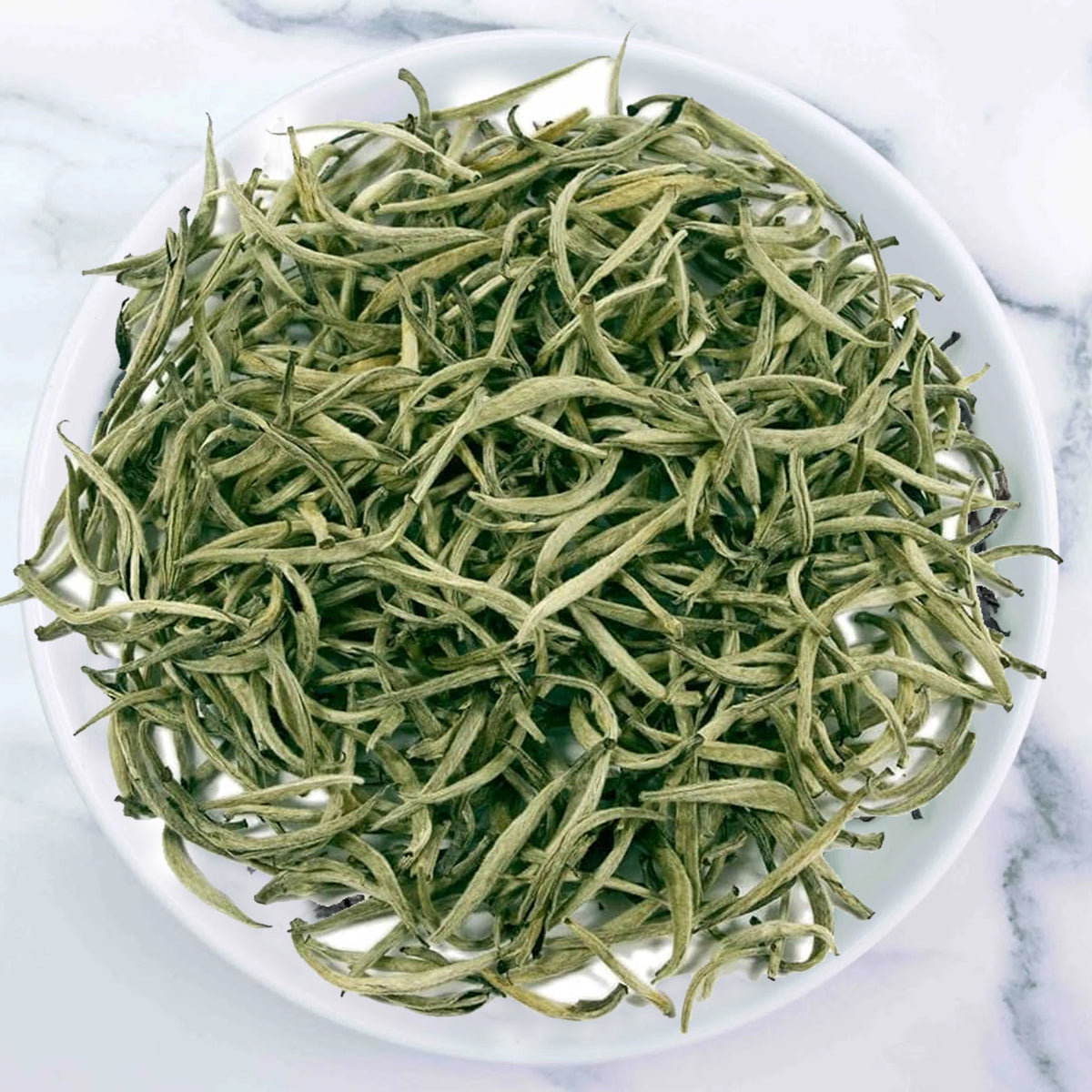 Ceylon Premium Golden Tea handcrafted from golden unopened tea buds with rich amber gold infusion by Johns Ceylon Tea UK