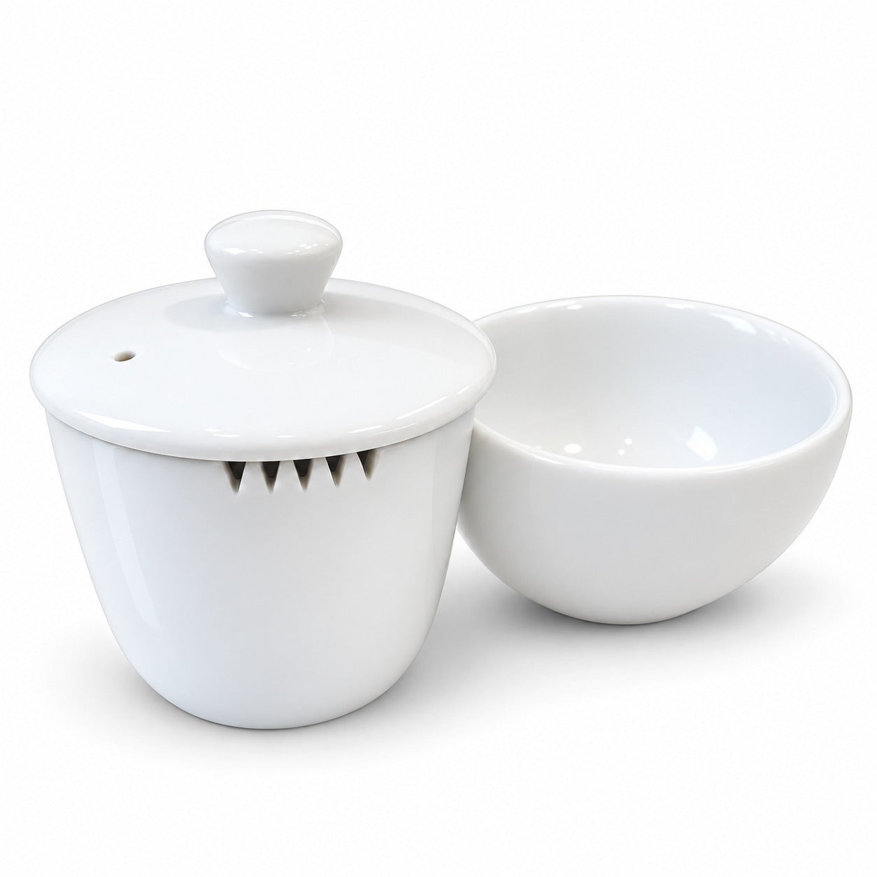 White ceramic tea set with a lidded gaiwan and a matching teacup on a clean white background.